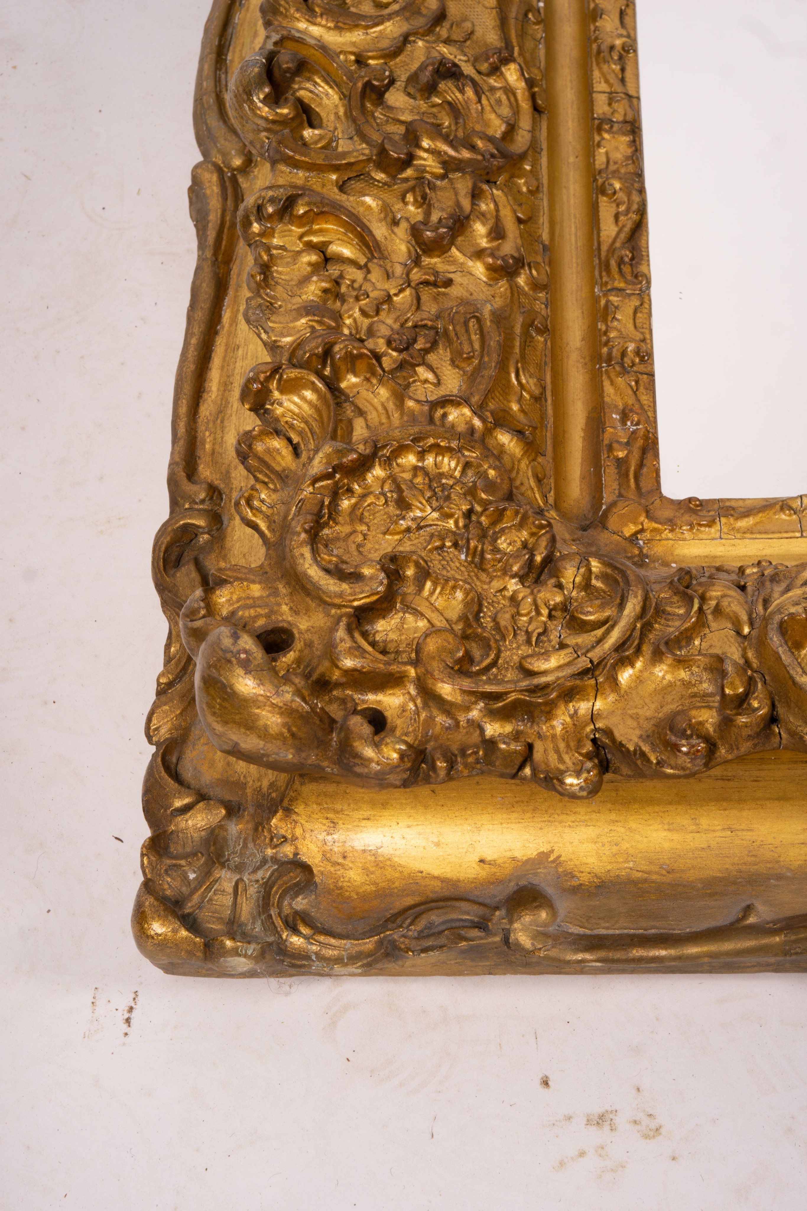 An ornate Victorian giltwood and gesso rectangular wall mirror (formerly a picture frame) width 130cm, height 112cm